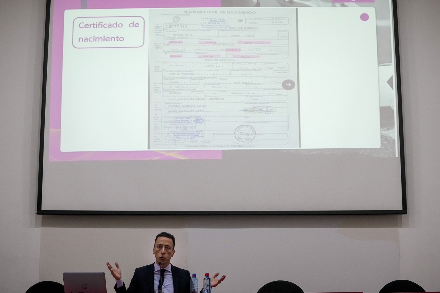 Lawyer Eduardo Carlezzo shows a Colombian birth certificate he says belongs to Ecuador&#039;s national soccer team player Byron Castillo, in reference to the claim by the Chilean soccer federation ask ...