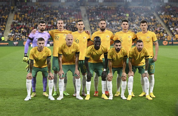 The Australian national soccer team, the Socceroos, pose for a photo before the start of a friendly soccer international between Australia and New Zealand in Brisbane, Australia, Thursday, Sept. 22, 2 ...