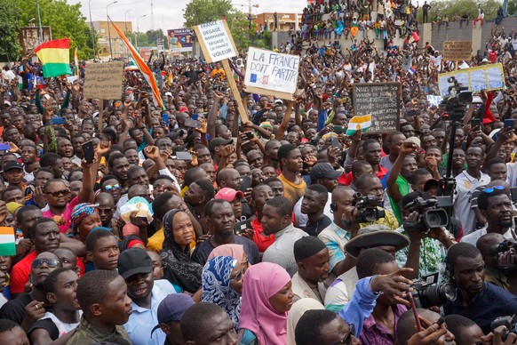 epa10783063 Protesters chant slogans during a rally in Niamey, Niger, 03 August 2023. Protesters rallied against the sanctions imposed on their country by the Economic Community of West African States ...