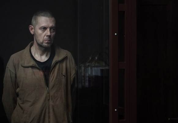 epa10690891 Ukrainian prisoner of war Anatoly Gritsyk stands in the defendant&#039;s cage during a hearing in the Southern District Military Court in Rostov-on-Don, Russia, 14 June 2023. Twenty-four U ...