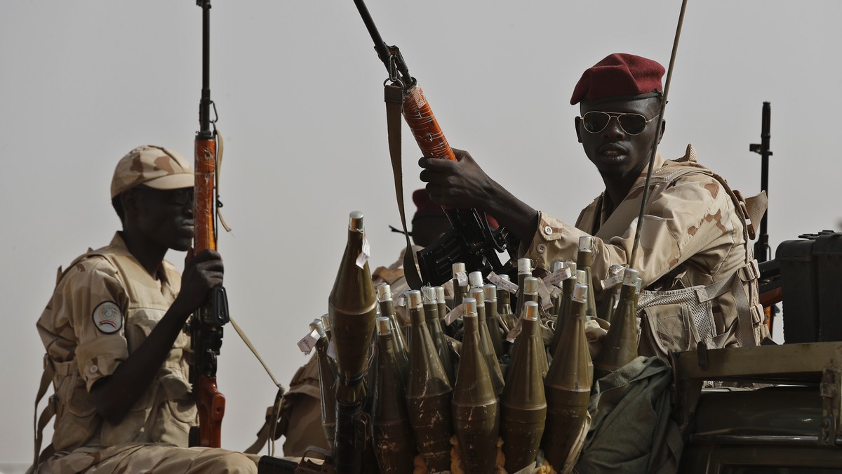 FILE - Sudanese soldiers from the Rapid Support Forces unit, led by Gen. Mohammed Hamdan Dagalo, the deputy head of the military council, secure the area where Dagalo attends a military-backed tribe&# ...