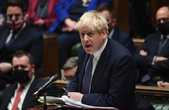 In this handout photo provided by UK Parliament, Britain&#039;s Prime Minister Boris Johnson speaks during Prime Minister&#039;s Questions in the House of Commons, London, Wednesday, Jan. 5, 2022. (Je ...