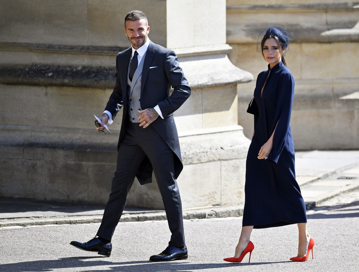 epa06748935 British former soccer player David Beckham (L) and Victoria Beckham (R) arrive for the royal wedding ceremony of Britain's Prince Harry and Meghan Markle at St George's Chapel in ...