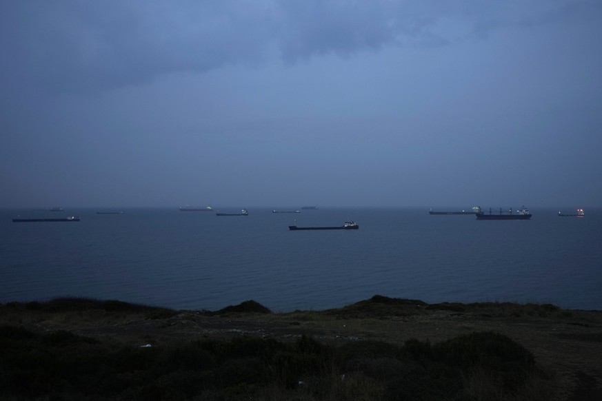 FILE - Cargo ships anchor at the Black Sea wait to cross the Bosporus strait in Istanbul, Turkey, on Nov. 17, 2022. The United Nations is racing to extend a deal that has allowed for shipments of Ukra ...