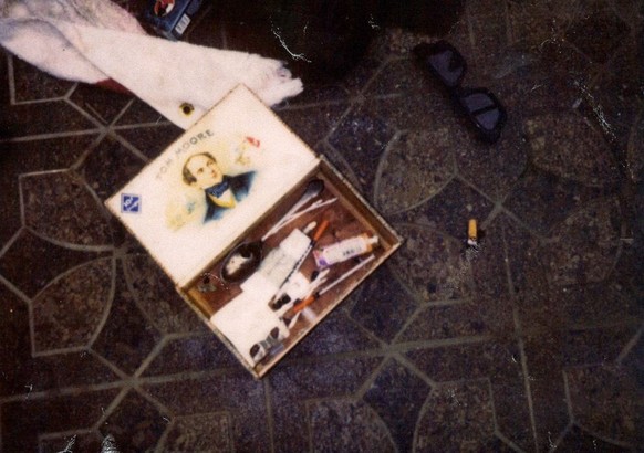 epa04134829 A handout photo made available by the Seattle Police Department on 21 March 2014 shows a box with injecting equipment in the house of US singer Kurt Cobain in Seattle, Washington State, US ...
