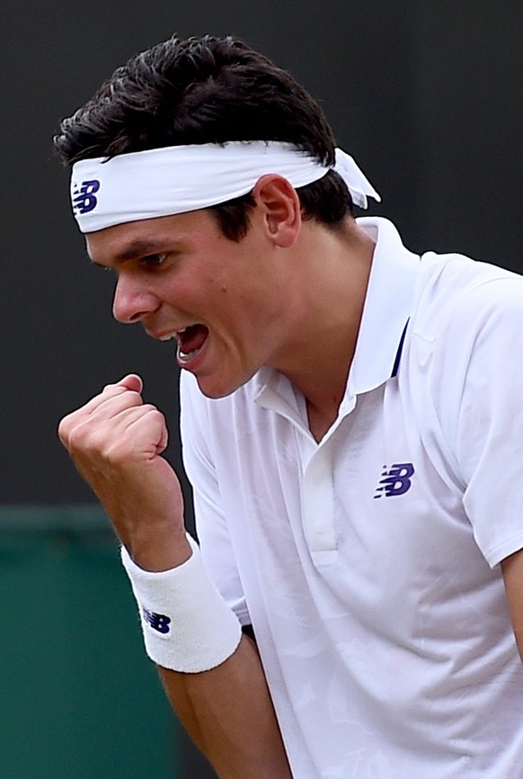 epa06071018 Milos Raonic of Canada in action against Mikhail Youzhny of Russia during their second round match for the Wimbledon Championships at the All England Lawn Tennis Club, in London, Britain,  ...