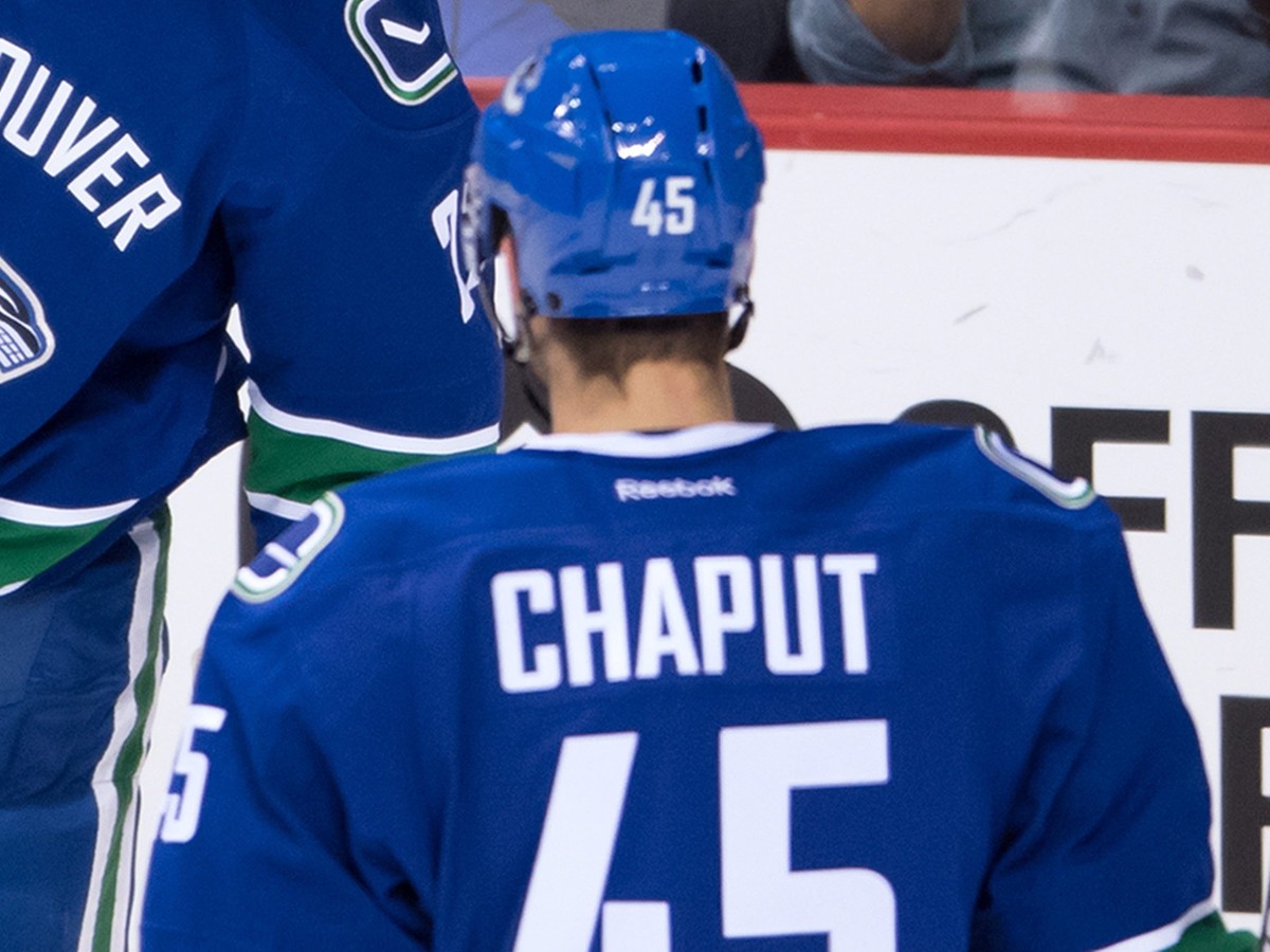 Vancouver Canucks' Ben Hutton, back, and Michael Chaput celebrate Hutton's goal against the Arizona Coyotes during the second period of a preseason NHL hockey game in Vancouver, British Colu ...