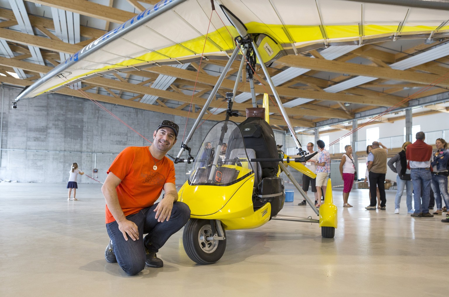 epa06104850 Swiss adventurer Xavier Rosset poses with his light sport aircraft (LSA) before embarking on the first day of his Fly the World adventure project, Sion, Switzerland, 23 July 2017. Rosset ...