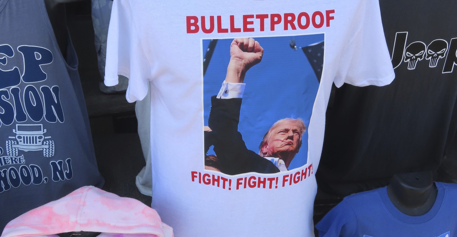 T-shirts referencing the shooting of former President Donald Trump were selling briskly on the boardwalk in Wildwood, N.J. on July 15, 2024, less than 48 hours after the incident. (AP Photo/Wayne Parr ...