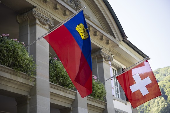 The flags of Liechtenstein, left, and Switzerland, right, wave during an official visit of Liechtenstein&#039;s Prime Minister Brigitte Haas in Kehrsatz near Bern, Switzerland, Monday, August 11, 2025 ...