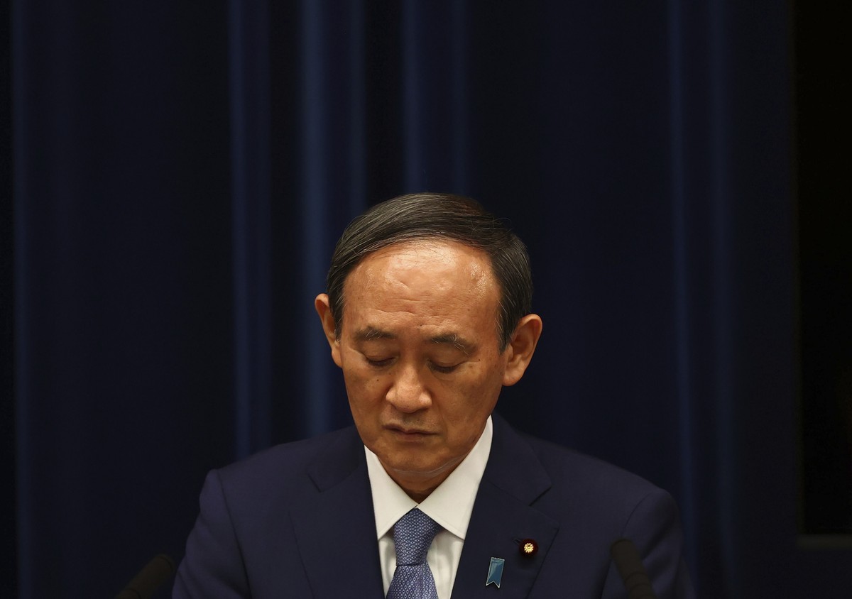 Japan's Prime Minister Yoshihide Suga attends a news conference on Japan's response to the coronavirus pandemic at his official residence during the Tokyo 2020 Olympic Games in Tokyo, Japan, ...