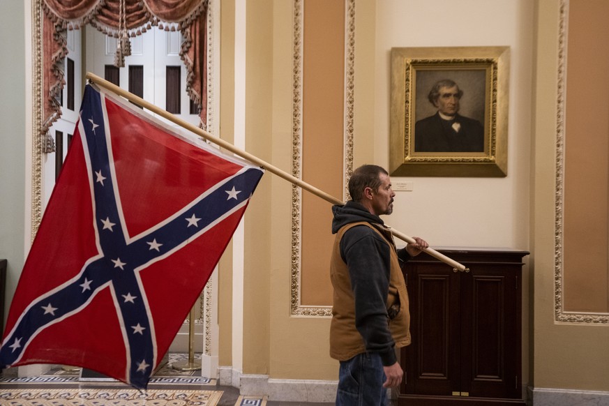epa08923405 Supporters of US President Donald J. Trump outside the senate chambers after breaching Capitol security in Washington, DC, USA, 06 January 2021. Protesters entered the US Capitol where the ...