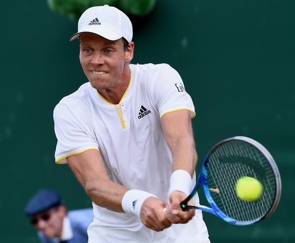 epa06070750 Tomas Berdych of Czech Republic in action against Ryan Harrison of the USA during their second round match for the Wimbledon Championships at the All England Lawn Tennis Club, in London, B ...