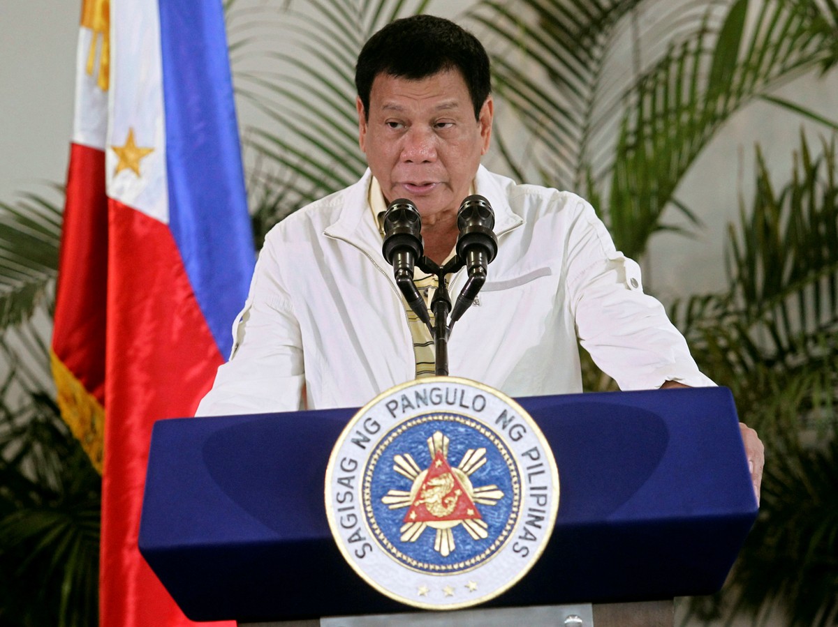 Philippines' President Rodrigo Duterte delivers his pre-departure message before leaving for the Association of Southeast Asian Nations (ASEAN) Summit in Laos at the Davao International Airport i ...