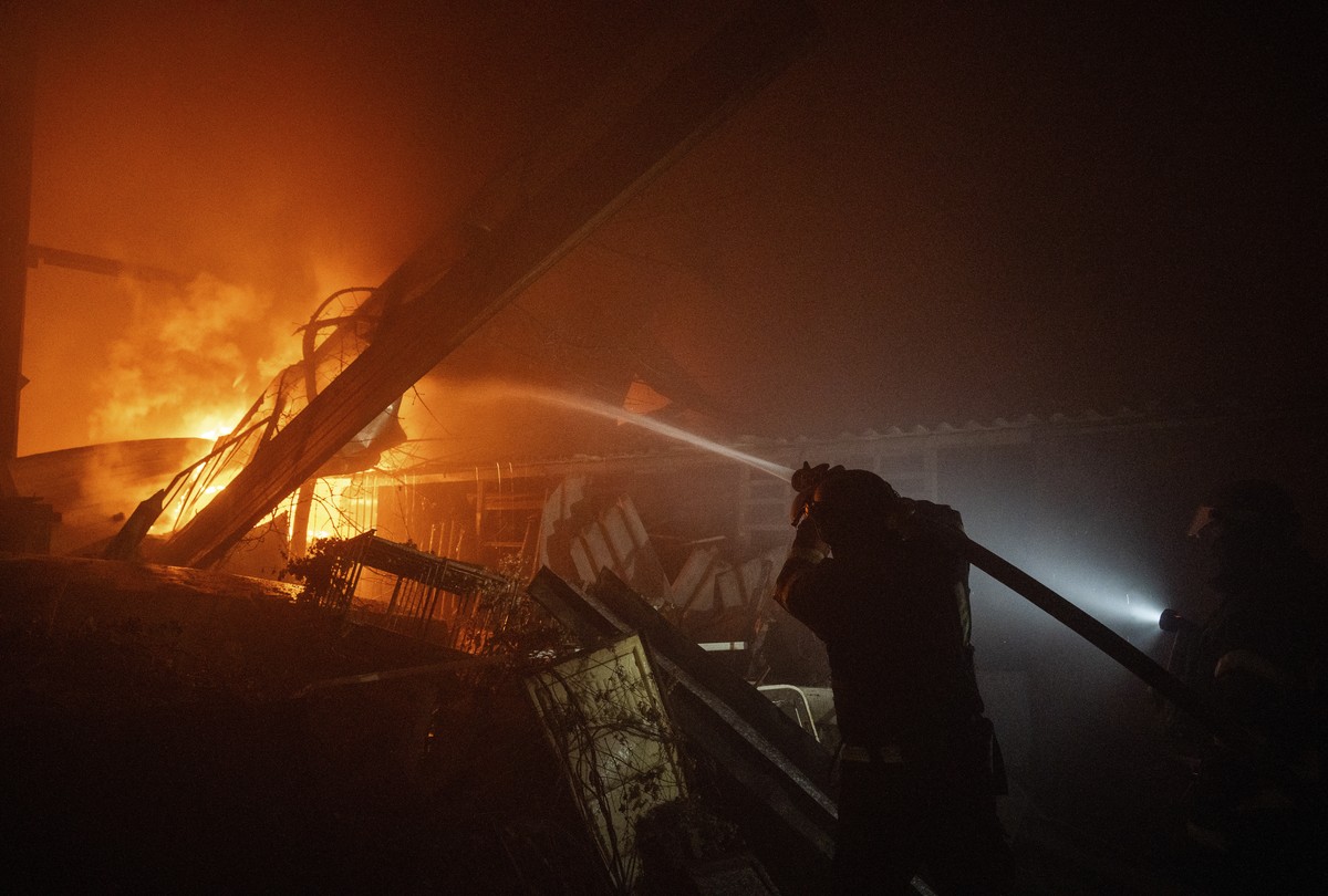epa12752499 Ukrainian firefighters work at the site of a recent Russian airstrike on a warehouse in Sloviansk, Ukraine, 17 February 2026 (issued 18 February 2026), amid the ongoing Russian invasion. A ...