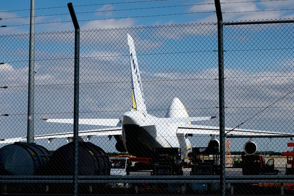epa13153515 A Ukrainian 'Antonov' cargo plane is pictured behind a security fence at the Airport Leipzig-Halle, in Schkeuditz, Germany, 06 August 2026. German police issued an alert at the a ...