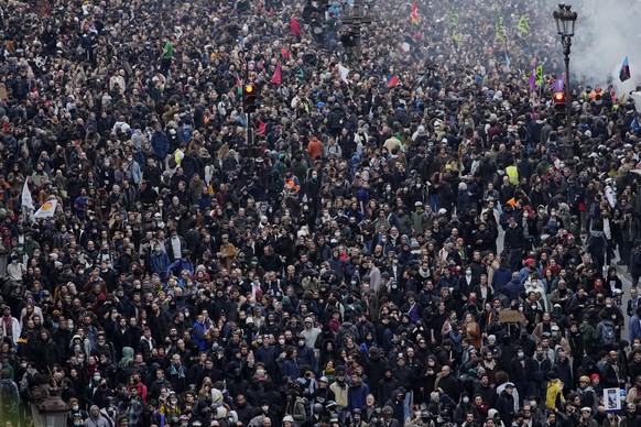 Protesters march during a rally in Paris, Thursday, march 23, 2023. French unions are holding their first mass demonstrations Thursday since President Emmanuel Macron enflamed public anger by forcing  ...