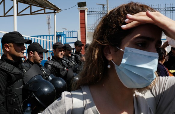 Protesters gather outside the UN headquarters in Erbil on Sept. 24, 2022, to protest the death of Masha Amini, who had fallen into a coma for three days after being detained by the morality police in  ...