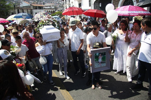 epaselect epa11250520 Family and friends say goodbye to Camila Gomez Ortega, 8, killed in the municipality of Taxco, in Guerrero, Mexico, March 29, 2024. Mexican opposition presidential candidate Xo...