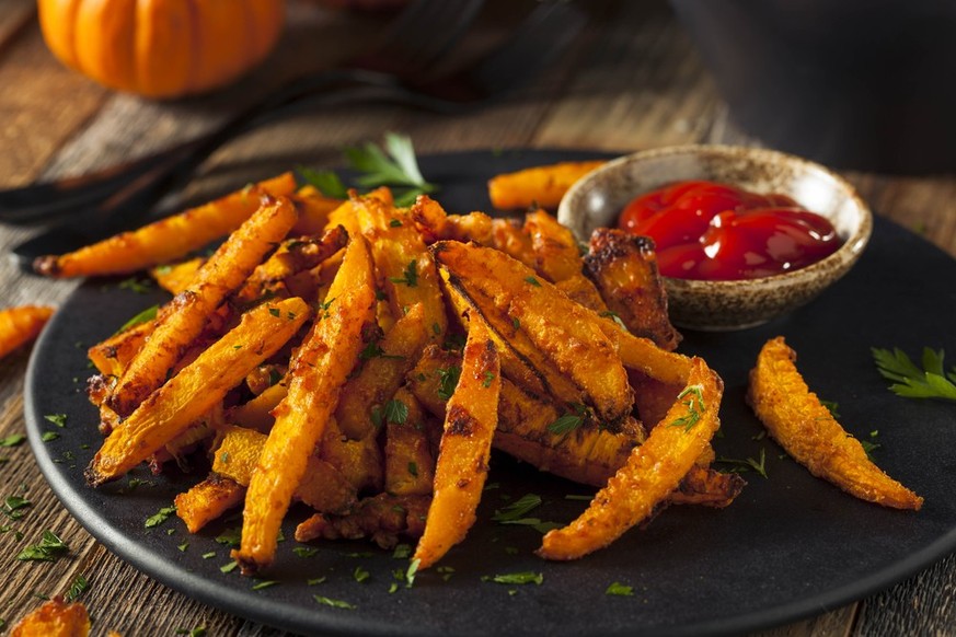 Home made pumpkin fries served with Ketchup