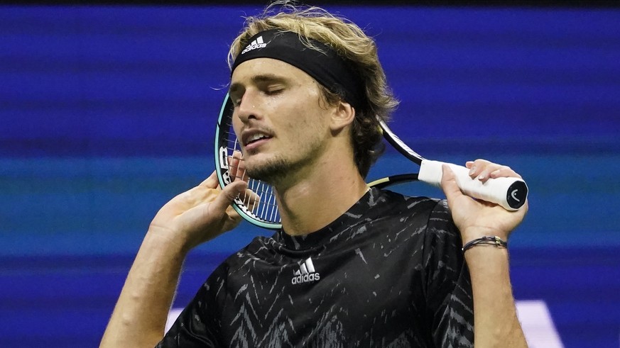 Alexander Zverev, of Germany, reacts after losing a point to Novak Djokovic, of Serbia, during the semifinals of the US Open tennis championships, Friday, Sept. 10, 2021, in New York. (AP Photo/Elise  ...