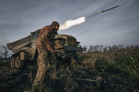 The Ukrainian army's Grad multiple rocket launcher fires missiles at Russian front-line positions near Bakhmut, Donetsk region, Ukraine, Nov. 24, 2022. (AP Photo/LIBKOS)