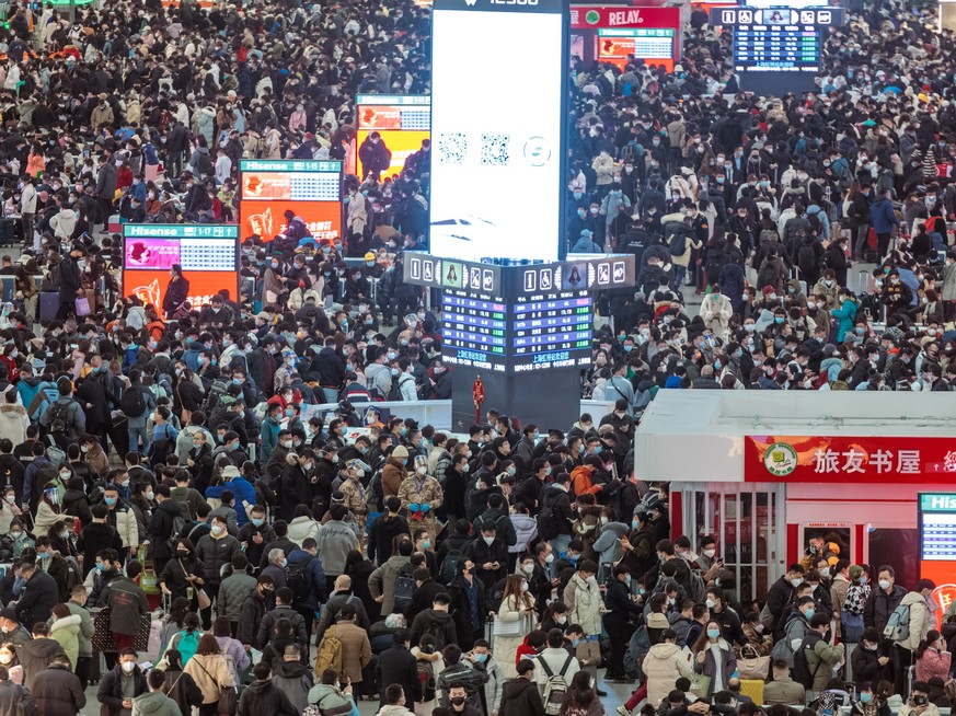 epa10404565 A general view of travellers waiting for their trains on the railway station, in Shanghai, China, 14 January 2023. Chinese New Year is the time of the world's largest human migration. ...