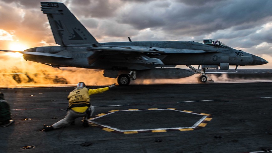 epa06325865 A handout photo made available by the US Navy on 13 November 2017 shows an F/A-18E Super Hornet of Strike Fighter Squadron (VFA) 115 launching from the flight deck of the Navy&#039;s forwa ...