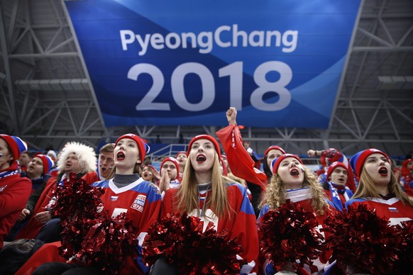 Fans cheer for Russian athletes during the second period of the quarterfinal round of the men&#039;s hockey game between Norway and the team from Russia at the 2018 Winter Olympics in Gangneung, South ...