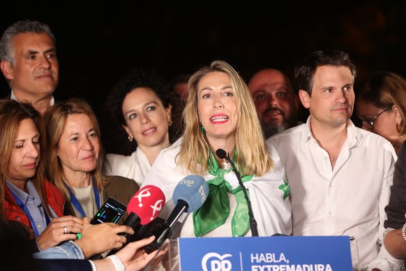 epa10661320 President of the Popular Party (PP) and candidate for the presidency of the Junta de Extremadura Maria Guardiola (C) celebrates her victory during a press conference after learning the res ...