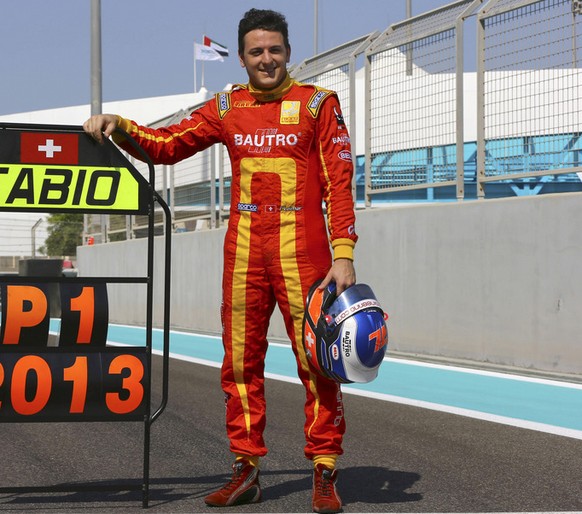 Swiss GP2 racing driver Fabio Leimer poses for photographers at the Yas Marina racetrack in Abu Dhabi, United Arab Emirates, Sunday, Nov. 3, 2013. Leimer secured the GP2 Drivers&#039; Championship tit ...