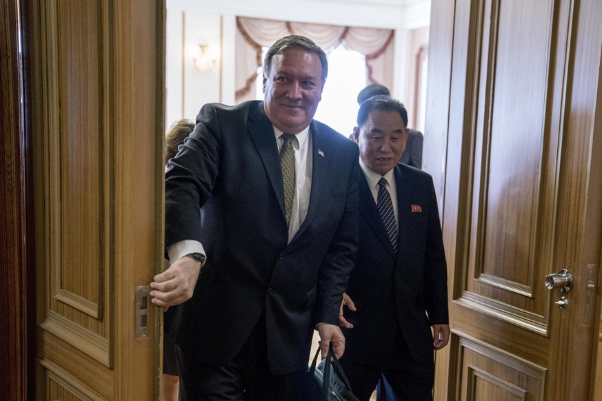 U.S. Secretary of State Mike Pompeo, left, and Kim Yong Chol, right, a North Korean senior ruling party official and former intelligence chief, depart following two days of meetings at Park Hwa Guest  ...