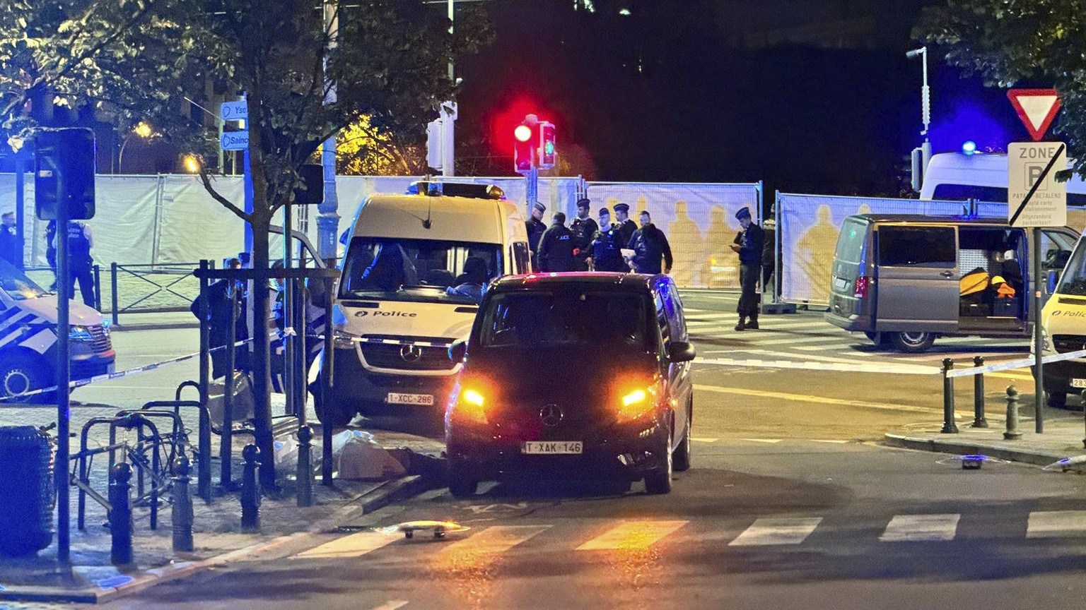 Police cordon off an area where a shooting took place in the center of Brussels, Monday, Oct. 16, 2023. Belgian police say that two people are dead in central Brussels after several shots were fired.  ...