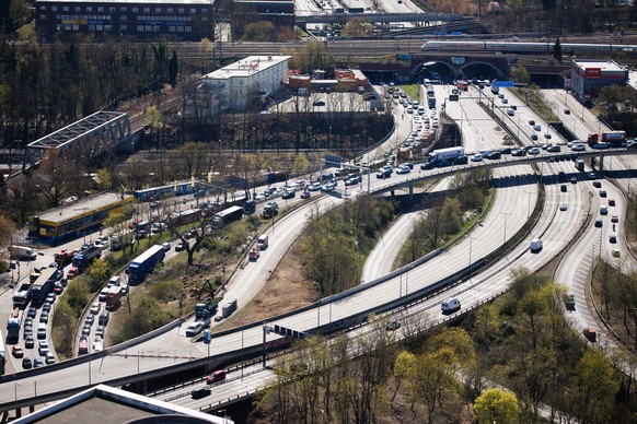 epa12009446 Cars queue up in a traffic jam around the A100 city highway bridge (C) in Berlin, Germany, 04 April 2025. As the senate of Berlin informed in a press release, the demolition of the depilat ...