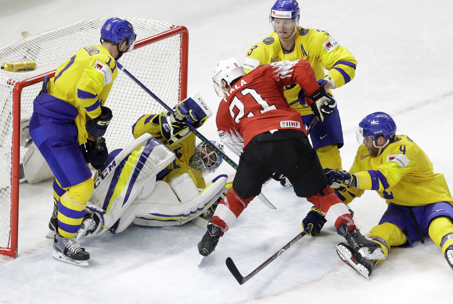 Sweden's goalie Anders Nilsson makes a save against Switzerland's Kevin Fiala during the Ice Hockey World Championships final match between Sweden and Switzerland at the Royal arena in Copen ...
