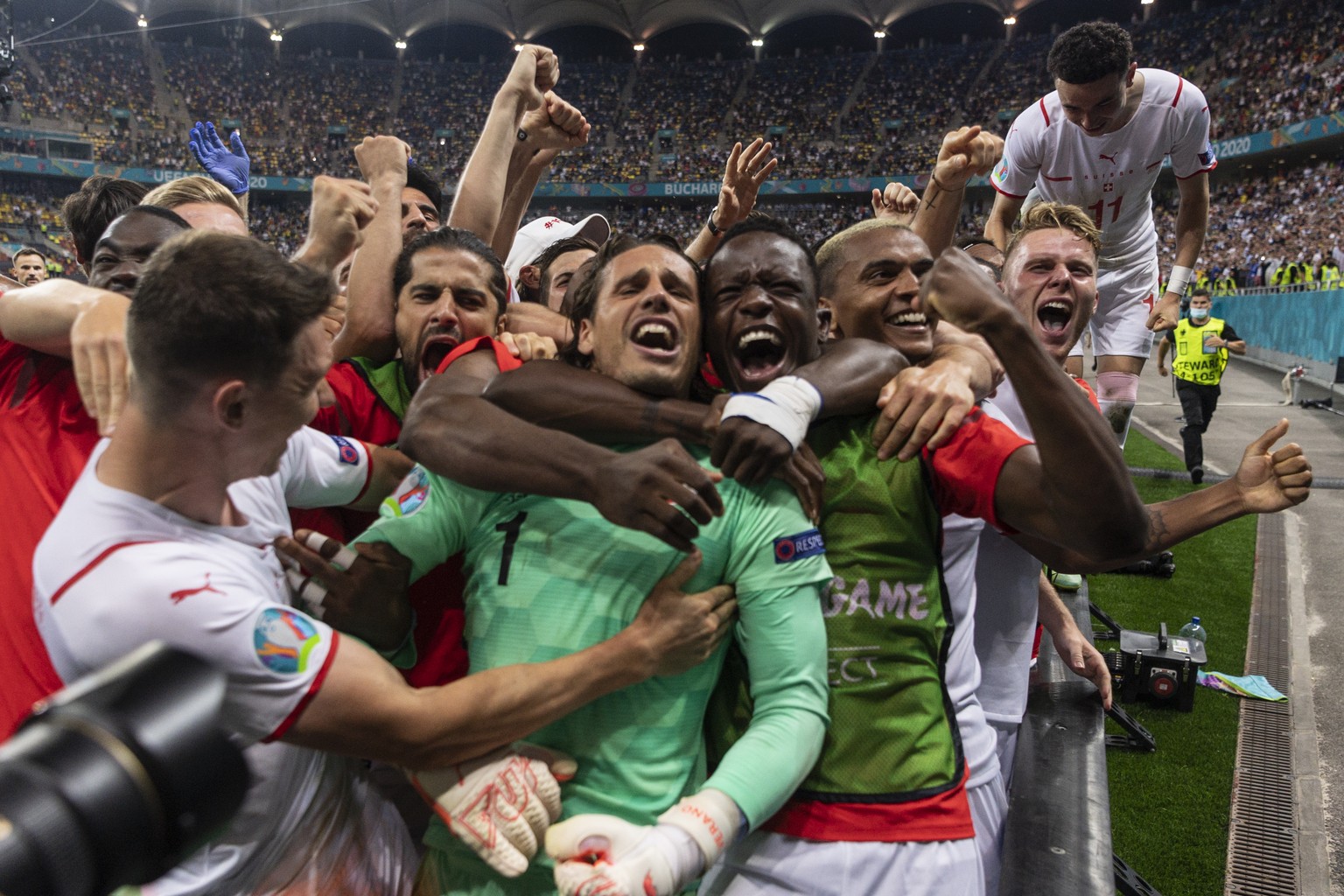 The Swiss team, with from right, Silvan Widmer, Manuel Akanji, Denis Zakaria, goalkeeper Yann Sommer, Ricardo Rodriguez, Christian Fassnacht and goalkeeper Yvon Mvogo, celebrates after winning the Eur ...