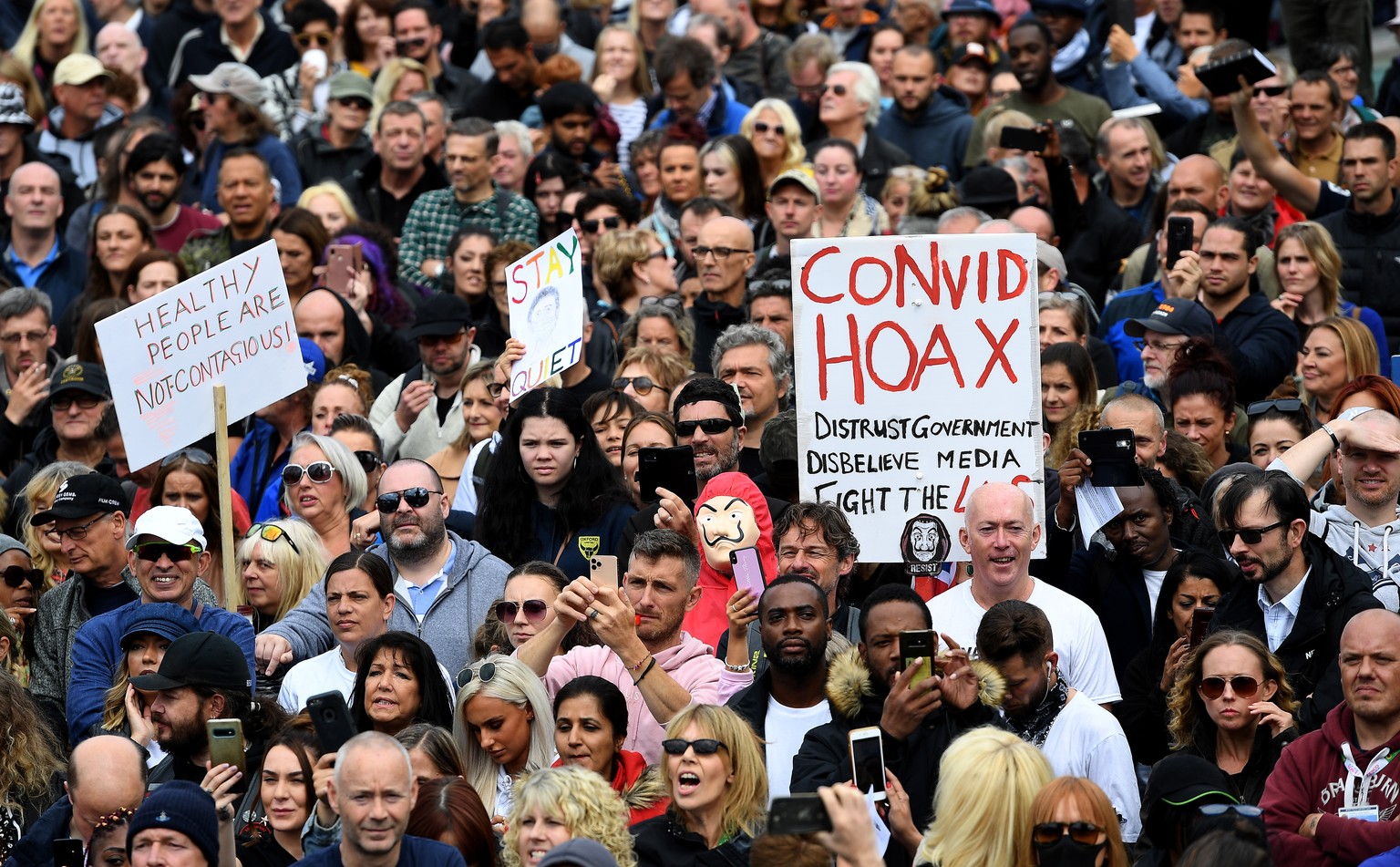 epa08633429 Thousands of people protest at Trafalgar Square against the Coronavirus lockdown in London, Britain, 29 August 2020. Protesters demonstrated against the wearing of masks, government propos ...