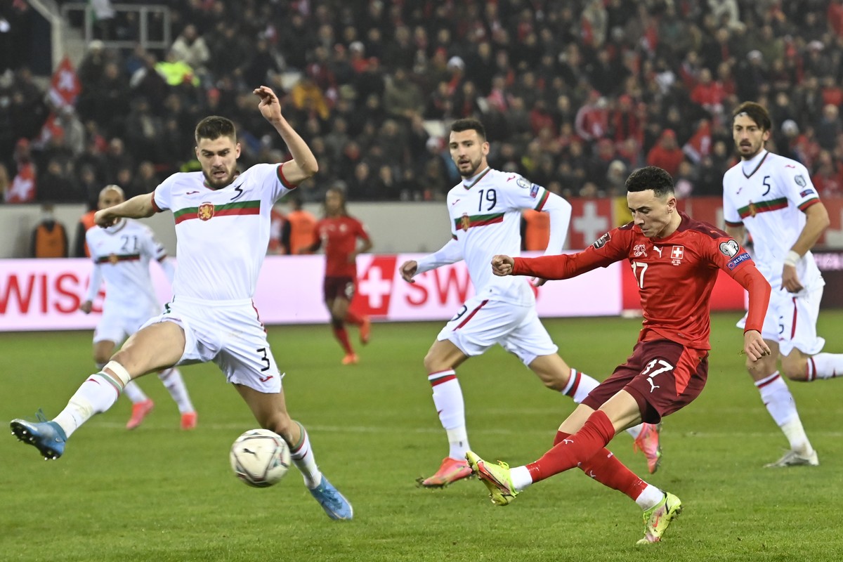 Switzerland's midfielder Ruben Vargas, right, scores the second goal in front of Bulgaria's defender Andrea Hristov, left, during the 2022 FIFA World Cup European Qualifying Group C match be ...