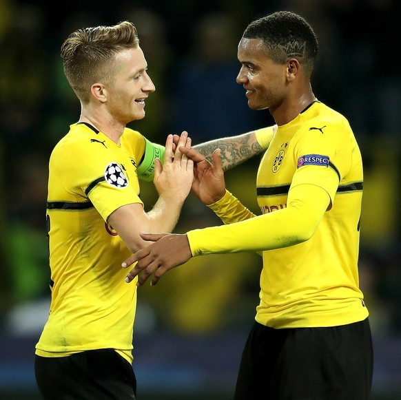 epa07067642 Dortmund&#039;s Marco Reus (L) celebrates with teammate Manuel Akanji after scoring a goal during the UEFA Champions League Group A soccer match between Borussia Dortmund and AS Monaco in  ...