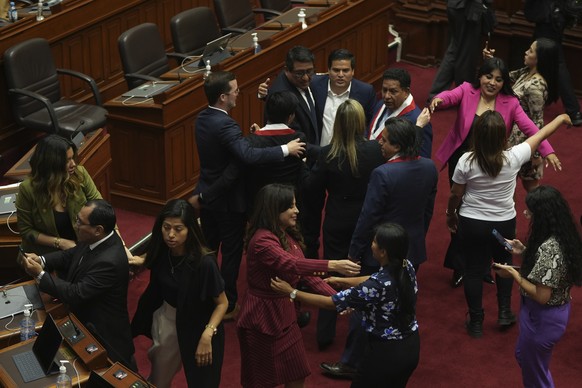 Lawmakers celebrate after verbally voting to remove President Pedro Castillo from office in Lima, Peru, Wednesday, Dec. 7, 2022. Peru&#039;s Congress voted to remove Castillo from office Wednesday and ...