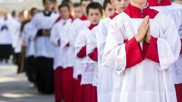 Children walk in a procession before a mass ordination of the breakaway Roman Catholic sect, the Society of St Pius X, in Econe, western Switzerland, June 27, 2014. 8 fundamentalist priests and 7 deac ...