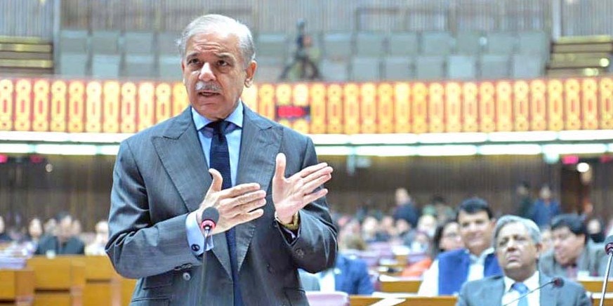 epa12523579 A handout picture made available by the Press Information Department (PID) shows Prime Minister Shehbaz Sharif attending a parliament session as it votes on the 27th constitutional amendme ...