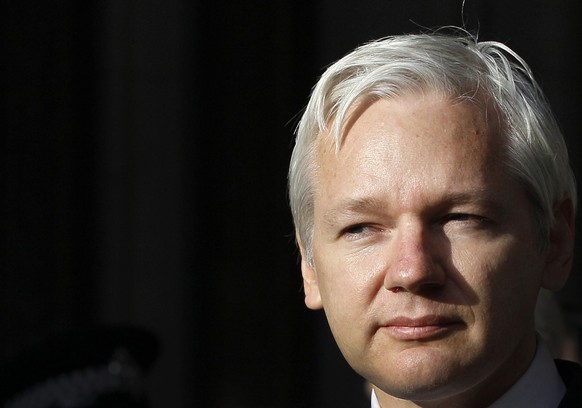 FILE - WikiLeaks founder Julian Assange pauses as he makes a statement to media gathered outside the High Court in London, on Dec. 5, 2011. Australia