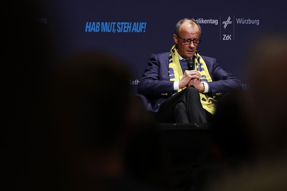 epa12959610 German Chancellor Friedrich Merz attends a talk with youth during the 104th German Catholic Convention (Katholikentag) in Wuerzburg, Germany, 15 May 2026. The Convention takes place betwee ...