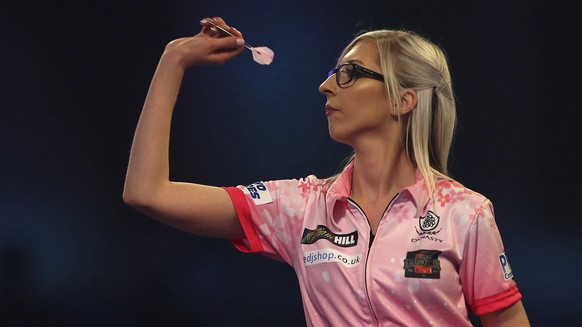 Fallon Sherrock and Ted Evetts in action at the PDC Darts World Championship at Alexandra Palace, London, Tuesday Dec. 17, 2019. Sherrock become the first female player to beat a man at the PDC World  ...
