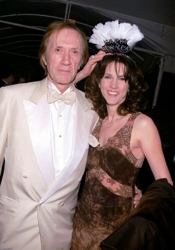 383820 05: Actor David Carradine with his wife, Marina attend the 2001 Millennium New Year&#039;s Eve Bash held at the Four Seasons Hotel December 31, 2000 in Beverly Hills, CA. (Photo by Newsmakers)