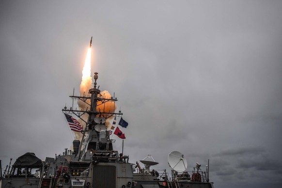 epa06667923 (FILE) - A handout photo file made available by the US Navy on 14 April 2018, shows the Arleigh Burke-class guided-missile destroyer USS Donald Cook (DDG 75) firing a standard missile 3 du ...