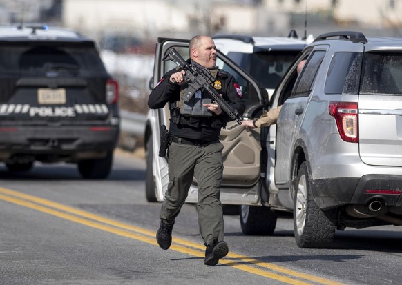 Police form a perimeter on Airport Road south of the North River in Bridgewater, Va., during a manhunt following a shooting at Bridgewater College Tuesday, Feb. 1, 2022. (Daniel Lin/Daily News-Record  ...