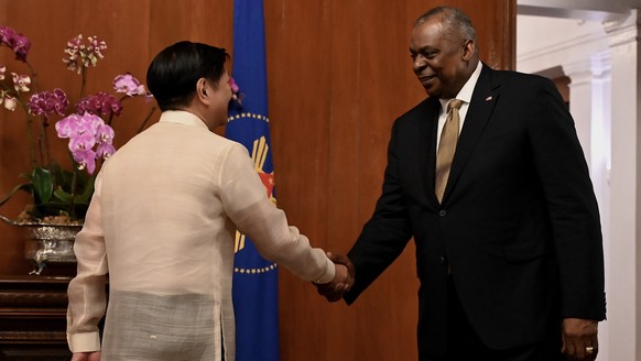 epa10443741 United States Defense Secretary Lloyd Austin (R) greets Philippine President Ferdinand Marcos Jr. (L), at the presidential palace in Manila, Philippines 02 February 2023. Austin is visitin ...