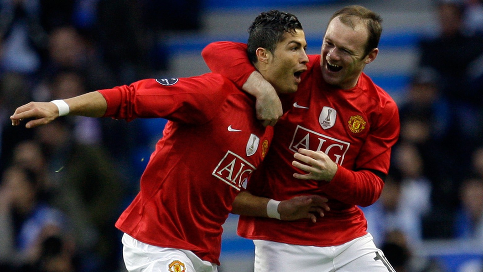 Manchester United&#039;s Cristiano Ronaldo celebrates with Wayne Rooney after scoring the opening goal against FC Porto during their Champions League quarterfinals, second leg, soccer match Wednesday, ...